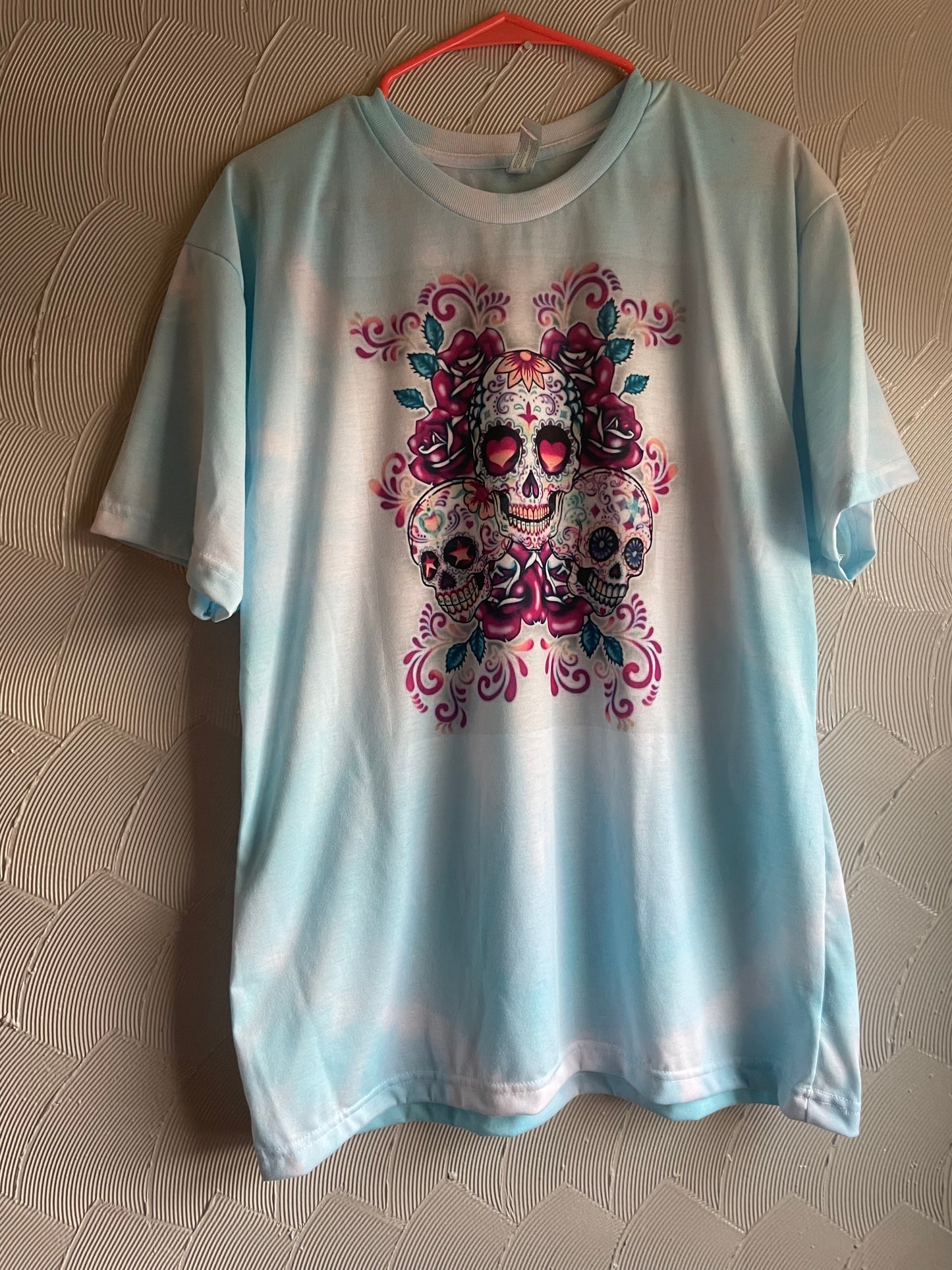 Tie Dye Sugar Skulls on Pastel Blue Shirt